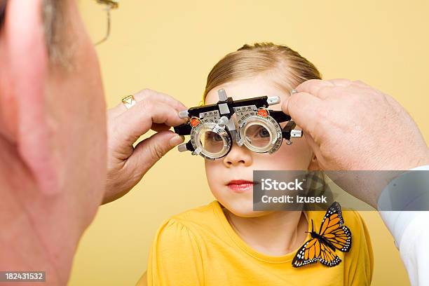 Optometrist Eye Exam Trial Frames Stock Photo - Download Image Now - 55-59 Years, 6-7 Years, 60-64 Years
