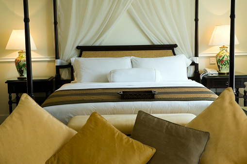 luxury hotel room bed with pillows