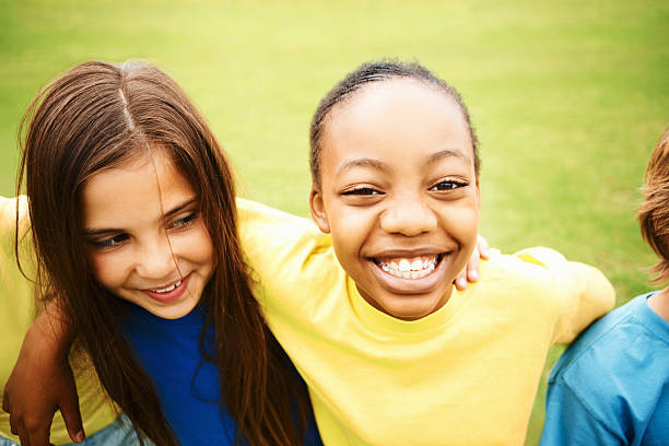 istock Multi ethnic children enjoying on the lawn 182432067