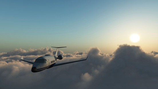 Bombardier Learjet 60 Corporate jet flying above the clouds.