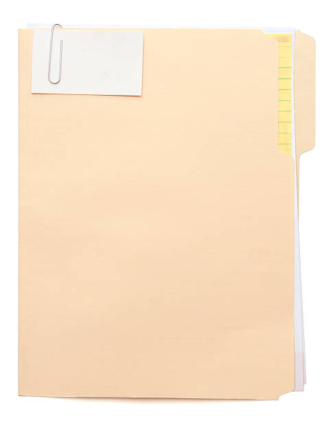 manila folder with a note paper clipped to the front - akte envelop stockfoto's en -beelden