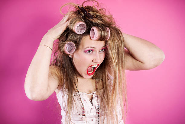 istock Young crazy woman with curlers 182432601