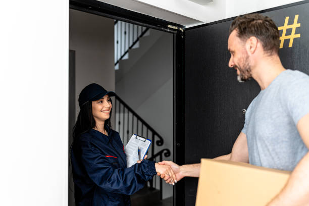 istock Friendly courier brings package to man's apartment with a personal touch 1824331687