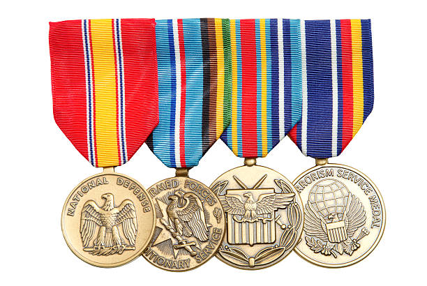 4 Military medals hanging on colorful ribbons stock photo