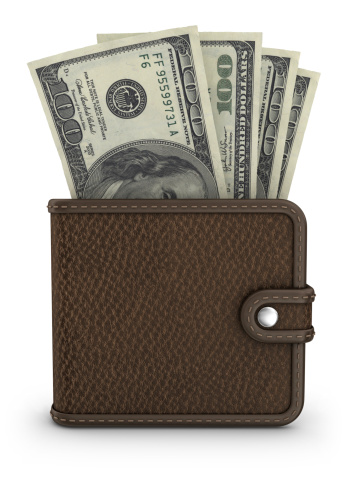 Men's wallet made of rough brown leather on a light wood background. stylish accessory for men, made in a classic design.