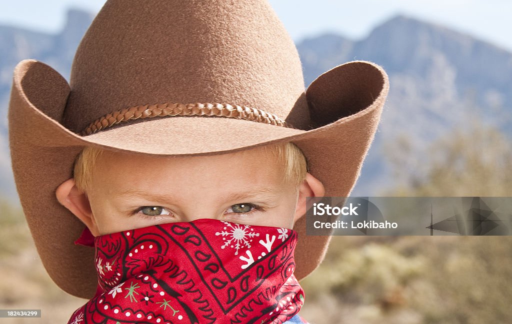 Little Cowboy in the Desert Young boy wearing a bandana and cowboy hat. 4-5 Years Stock Photo