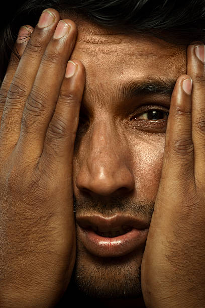 istock Man Holding his head in agony 182434638