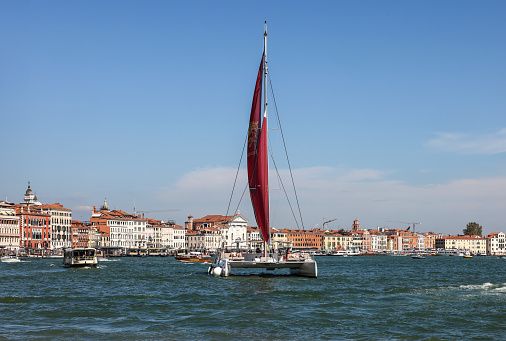 Venice, Italy - September 5, 2022: Catamaran sailing along the San Marco Canal in Venice, Italy