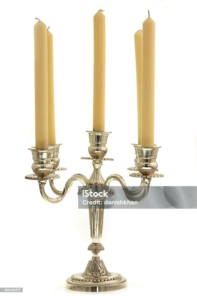 Candelabra and Candles on white Exquisitely made silver Candle Holder with Candles isolated on white Candlestick Holder Stock Photo