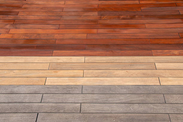 istock Wood planks texture - weathered, sanded, and freshly stained ipe deck, before and after maintenance concept 1824348180