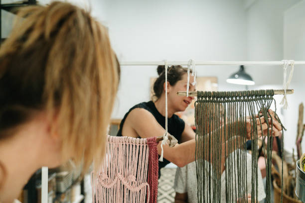 istock Craftswomen weaving makrame in a workshop 1824350935