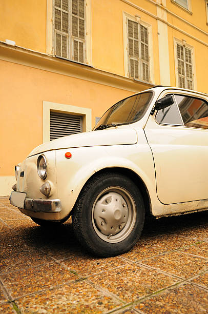 istock Side View of Original Fiat 500 by Building 182435569