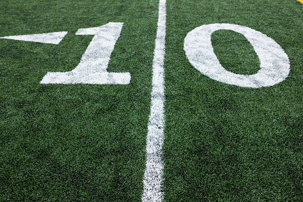 istock Football stadium 10 yard line artificial grass and markings 182435886