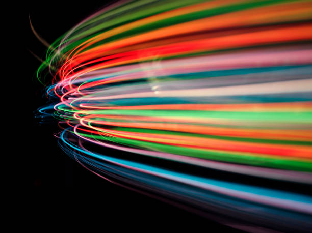 Speed of Coloured Lights "Curves of coloured lights.Click on the links below to see more of my pyrotechnic,medical and business images." red yellow neon stock pictures, royalty-free photos & images