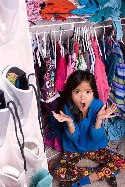 Kid trying colorful shirt