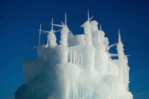 Towers, Spires from a Winter Ice Castle against Blue Sky