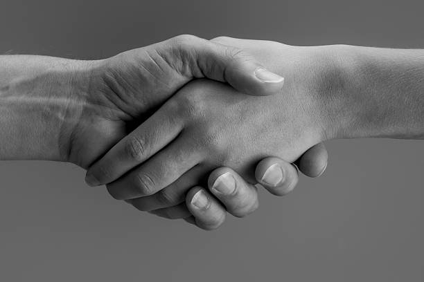 istock couple shaking hands XXL 182436644