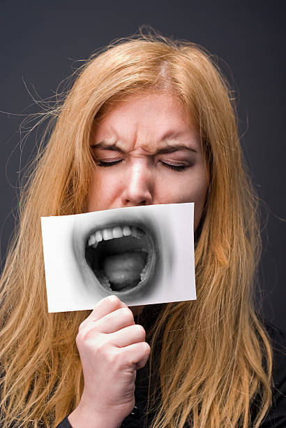 istock Girl yawning 182436776