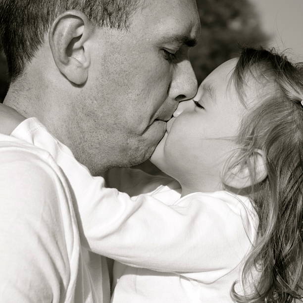 istock Little Girl Kissing Her Daddy 182437149