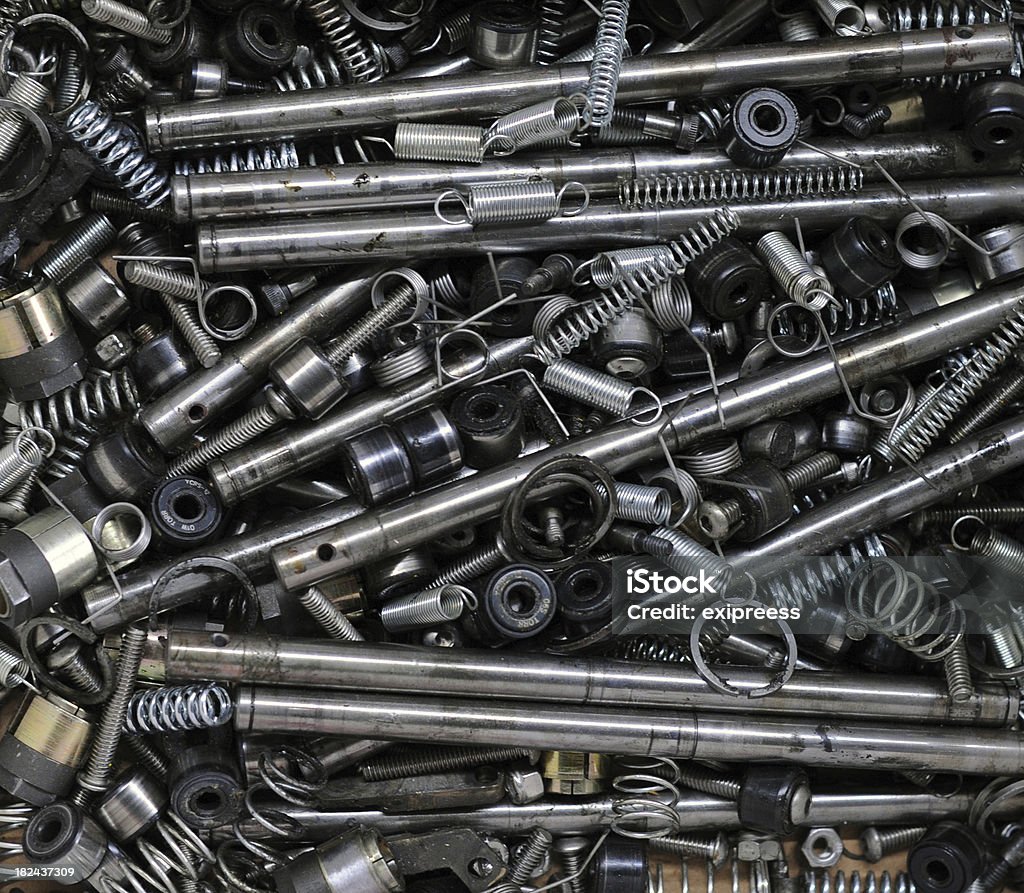 Various Mechanical parts "A top view of a pile of various, greasy mechanical parts including springs, shafts and bearings." Ball Bearing Stock Photo