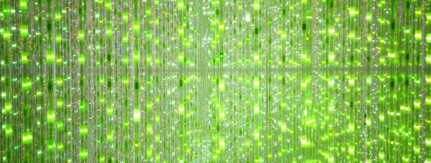 istock Green stage background of LED flashing and flickering bulbs. Illuminated backdrop. 1824375917