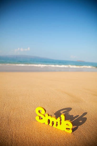 istock Word Smile On The Beach 182437959