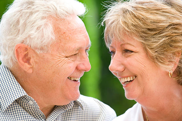 istock Loving senior couple looking at each other 182438042