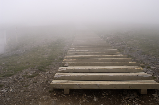 Steps up to Plomb du Cantal in the clouds. Walking in poor visibility