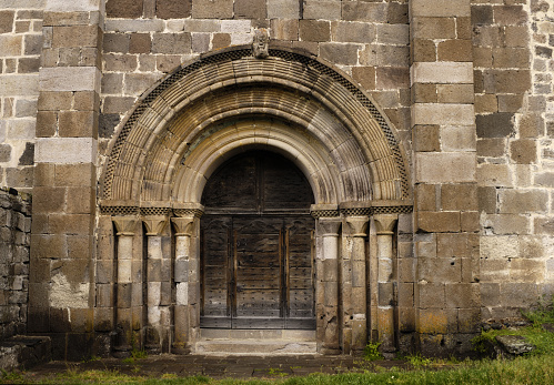 Door into Eglise Prieurale church at Bredons from 11th Century