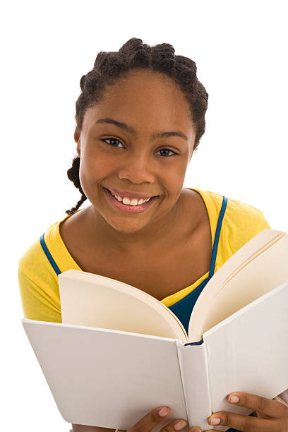 istock African ethnicity adolsecent holding a book with blank cover 182438282