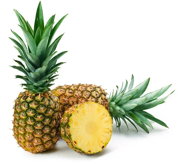 "Fresh pineapples on white. This file is cleaned, retouched, contains"