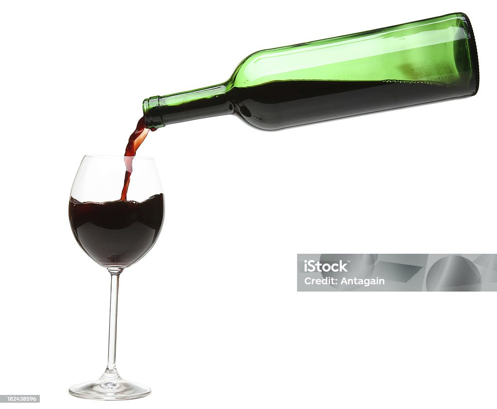 Red wine pouring into a wineglass. Red wine Drinking Glass Stock Photo