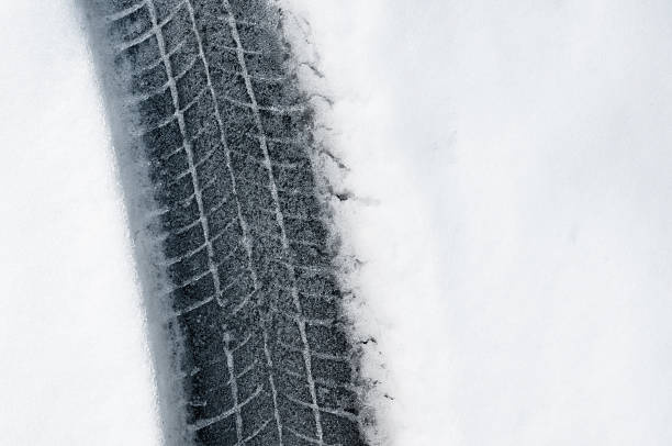 istock tire print track in snow 182438663