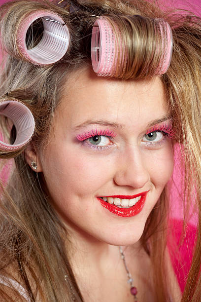 istock Young woman with curlers 182438764