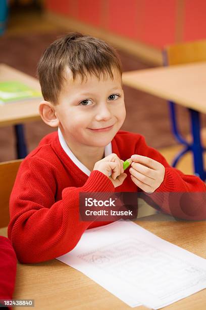 Happy School Boy Sitting At His Desk Stock Photo - Download Image Now - Red, Education, Child
