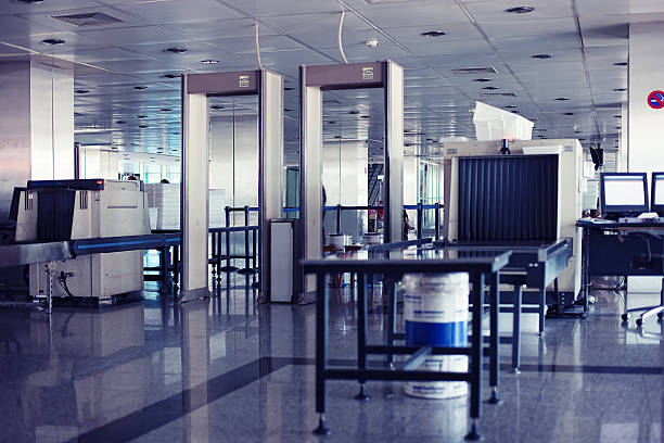 Airport security point with Xray and metal detectors Xray scanners and metal detectors at the airport security metal detector security stock pictures, royalty-free photos & images
