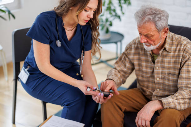 istock A young nurse in a blue uniform is taking blood samples from an elderly man. 1824401106