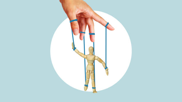 istock Collage with the marionette tied with drawn threads that pull by hand. Concept of business, deadlines, work pressure, influence, pressure of society and manipulation 1824402195