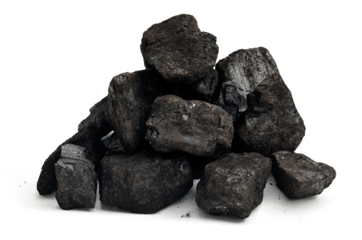 A small pile of coal isolated on a white background.