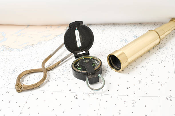 antike navigationstools - nautical chart drawing compass map old stock-fotos und bilder