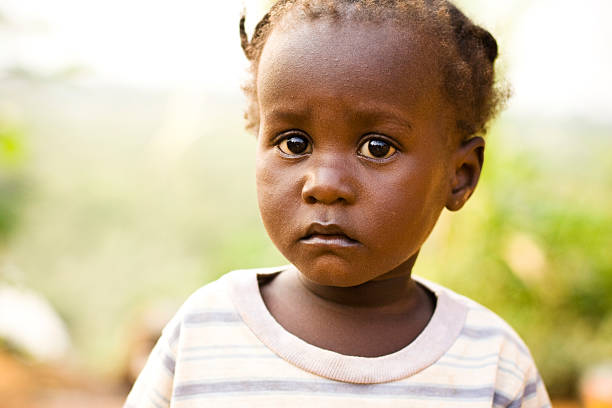 istock Young African girl with large eyes looking scared and sad 182440891