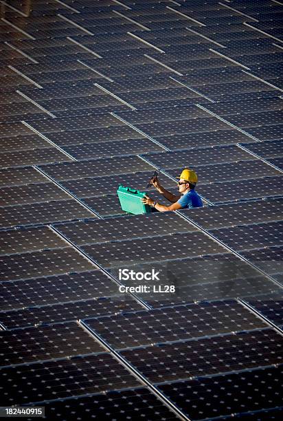 Testing At A Solar Farm Stock Photo - Download Image Now - Blue-collar Worker, Solar Energy, Adult