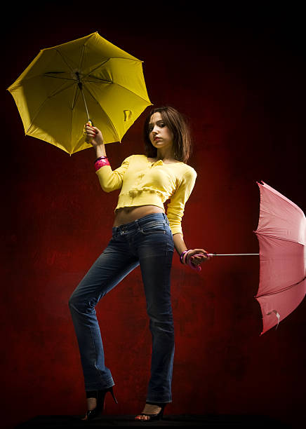 istock Fashion model with umbrellas 182440937
