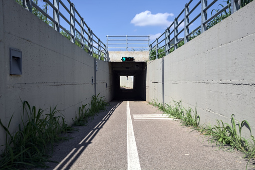 Bike  lane at the entrance of an underpass on a sunny day