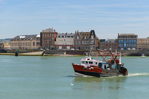 Le Treport, France - July 17, 2022: A fisherboat in the harbor of Treport on a sunny day in summer