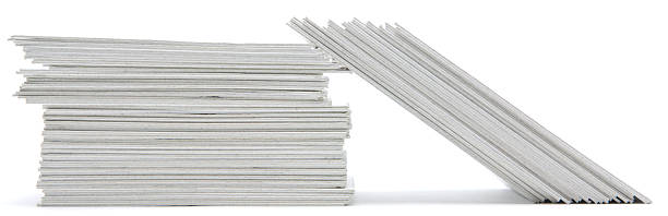 istock Stack of hand trimmed cards on white 182442138