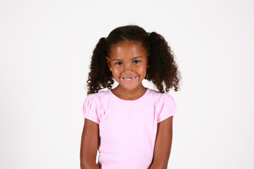 Studio portrait of a smiling African American girl