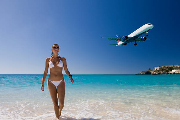 istock woman on vacation at Saint Martin beach 182442597