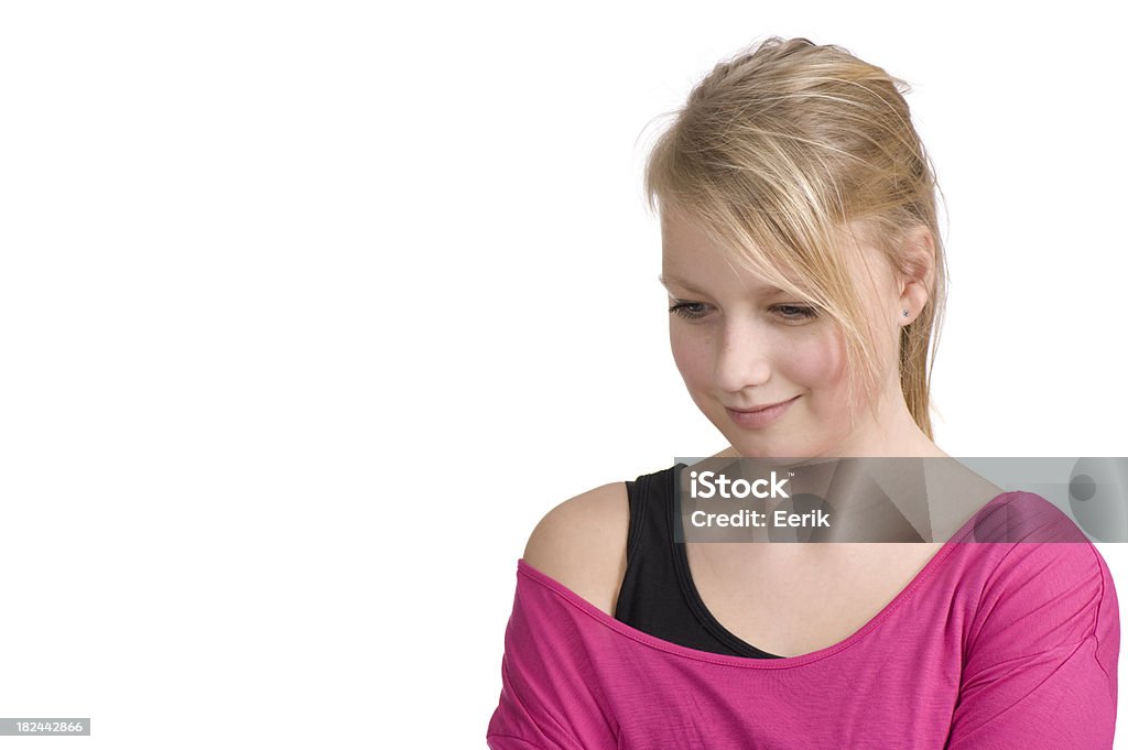 Young teenage girl lost in her thoughts Young teenage girl lost in her thoughts and looking down. Isolated on white. Adult Stock Photo