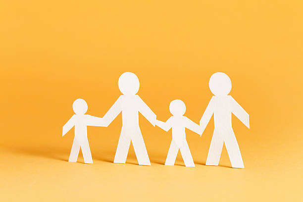 Family of four concept Family of four concept - paper people. family dependency mother family with two children stock pictures, royalty-free photos & images